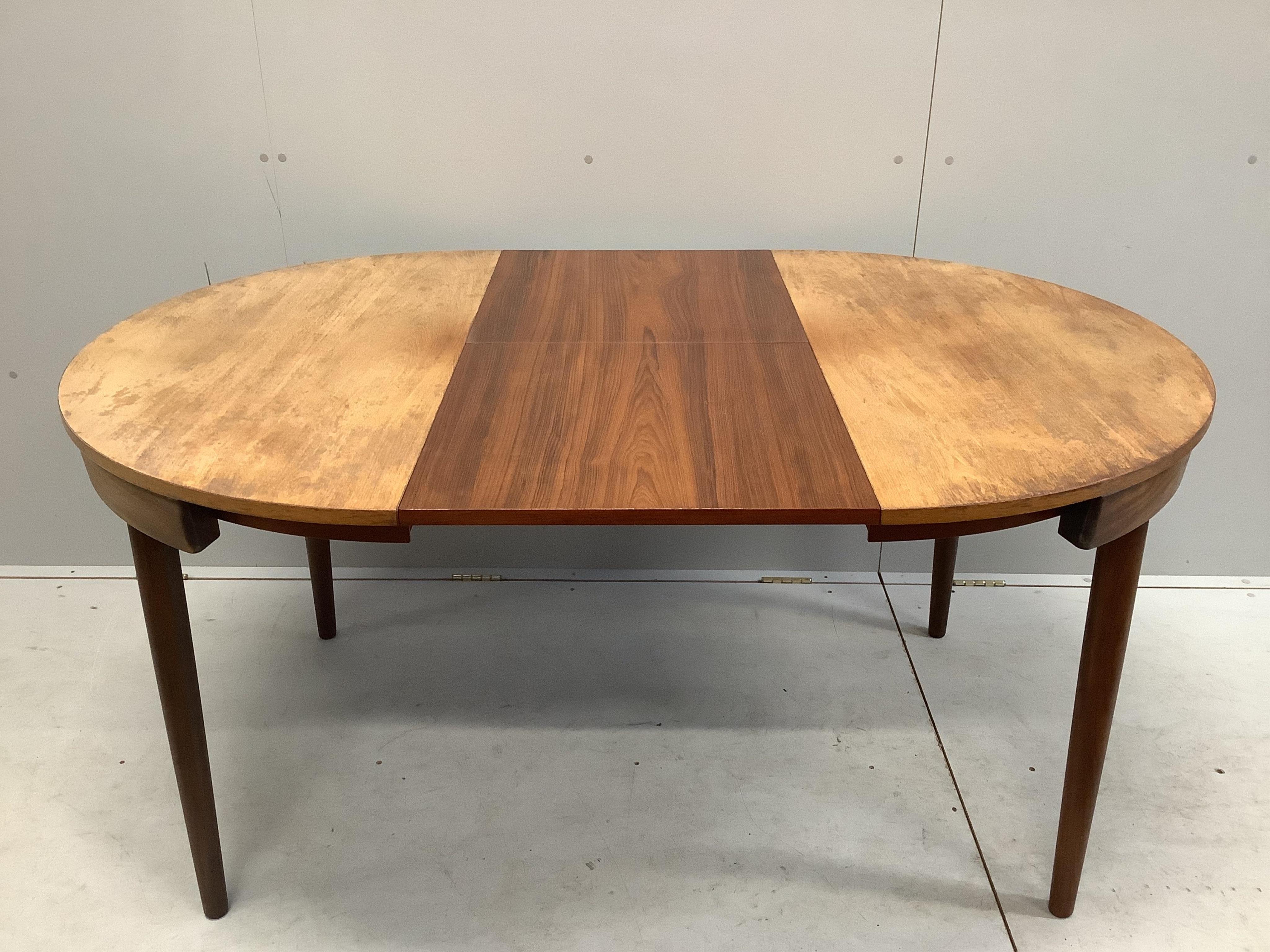 Hans Olsen for Frem Rojle, a mid century Danish teak 'Roundette' dining table, 156cm extended, depth 106cm, height 74cm together with four chairs. Condition - fair, top severely sun faded